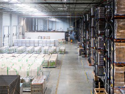 Huge distribution warehouse with high shelves, view from above